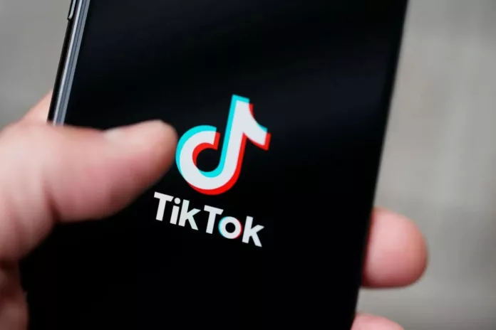tiktok , tiktok logo in smartphone, tiktok app in smartphone in a hand